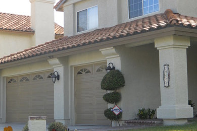 Mediterranean beige two-story stucco exterior home idea in Other