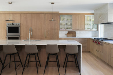Kitchen pantry - mid-sized contemporary l-shaped light wood floor and beige floor kitchen pantry idea in Minneapolis with a single-bowl sink, shaker cabinets, light wood cabinets, quartzite countertops, white backsplash, subway tile backsplash, stainless steel appliances, an island and white countertops