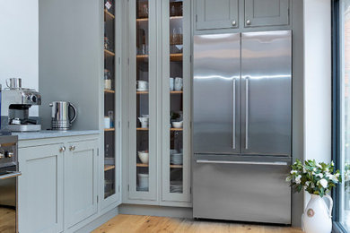 Design ideas for a small classic u-shaped kitchen/diner in Other with shaker cabinets, green cabinets, quartz worktops, a breakfast bar and grey worktops.