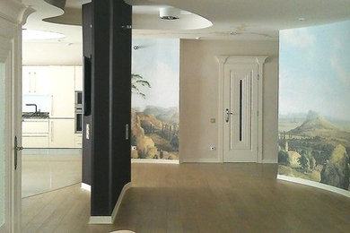 На фото: парадная, открытая гостиная комната среднего размера в стиле модернизм с бежевыми стенами, паркетным полом среднего тона, скрытым телевизором и разноцветным полом без камина с