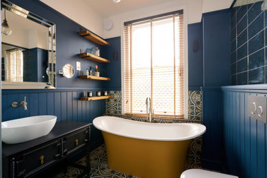 Dark Blue and Timber Bathroom with Gold Feature Bath