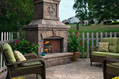 Patio - mid-sized transitional backyard stone patio idea in Chicago