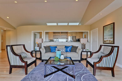 Inspiration for a large mid-century modern formal and open concept light wood floor and beige floor living room remodel in San Francisco with beige walls, no fireplace and no tv