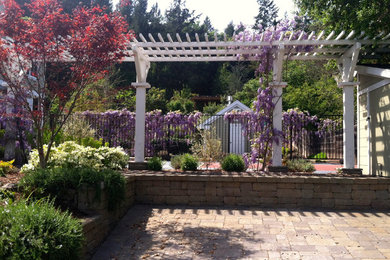 Design ideas for a large transitional full sun backyard stone retaining wall landscape in San Francisco.