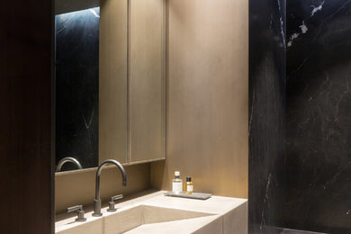 Inspiration for a mid-sized contemporary 3/4 black tile and stone slab concrete floor doorless shower remodel in New York with dark wood cabinets, brown walls and concrete countertops