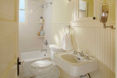 Example of a mid-sized arts and crafts kids' white tile and subway tile mosaic tile floor, multicolored floor, single-sink and wainscoting bathroom design in Dallas with a two-piece toilet, white walls, an undermount sink and a freestanding vanity