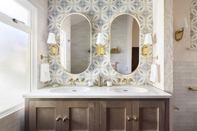 Example of a large classic master white tile and porcelain tile porcelain tile, orange floor, double-sink and vaulted ceiling bathroom design in Seattle with furniture-like cabinets, light wood cabinets, a one-piece toilet, beige walls, an undermount sink, quartz countertops, white countertops, a niche and a floating vanity