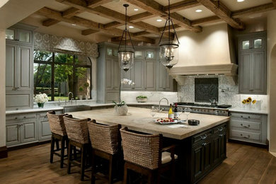 Kitchen - mediterranean l-shaped dark wood floor kitchen idea in Phoenix with a farmhouse sink, raised-panel cabinets, gray cabinets, white backsplash, stainless steel appliances and an island