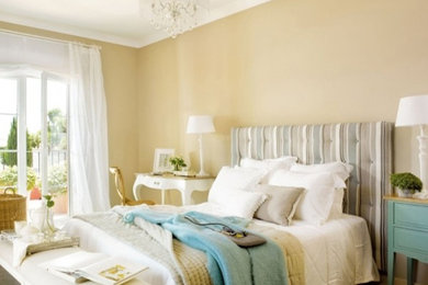Mid-sized elegant carpeted and brown floor bedroom photo in Austin with brown walls and no fireplace
