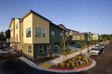 Example of a trendy three-story concrete fiberboard exterior home design in San Francisco with a shingle roof