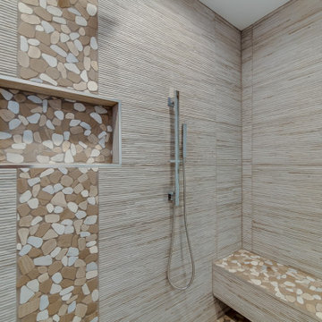 Pebble Mosaic Accent Stripe and Stone Bench in the Shower