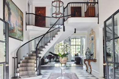 Foyer - huge traditional ceramic tile and multicolored floor foyer idea in Atlanta with white walls
