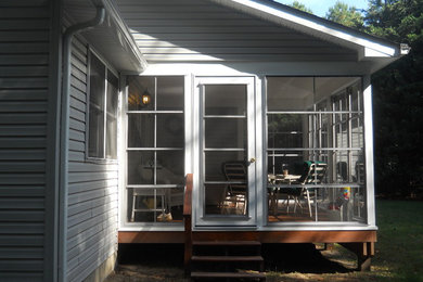 Example of a sunroom design in Other