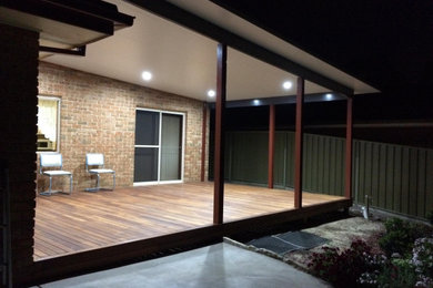 Photo of a modern backyard patio in Sydney with decking.