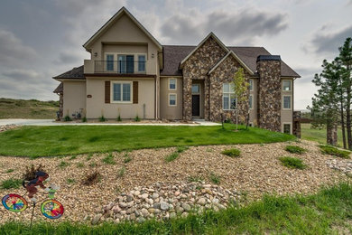 Mid-sized traditional brown three-story stucco exterior home idea in Denver with a shingle roof