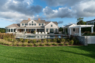 Inspiration for a large coastal multicolored two-story brick and clapboard exterior home remodel in Boston with a shingle roof and a gray roof