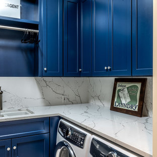 Small traditional separated utility room in Atlanta with a double-bowl sink, recessed-panel cabinets, blue cabinets, quartz worktops, a side by side washer and dryer and white worktops.