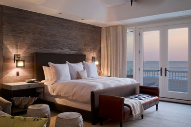 Inspiration for a mid-sized coastal master bedroom remodel in Baltimore with brown walls