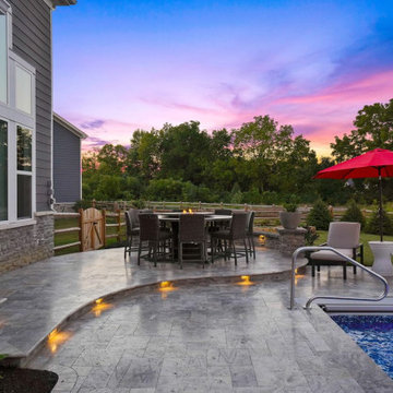 Pavilion with outdoor kitchen, gas fireplace and swim up bar.