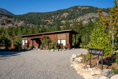 Small urban brown one-story metal house exterior photo in Seattle with a shed roof, a metal roof and a brown roof