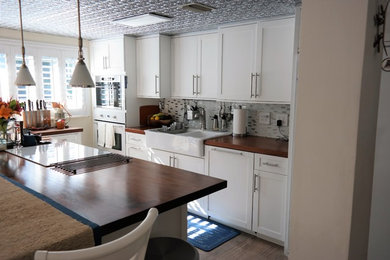 Cozy Cottage Style Kitchen with Muliple Use Island Maximizing Storage