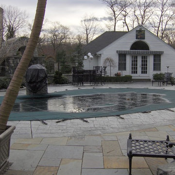 A beautiful creation & healthy koi pond with a guest house and swimming pool.