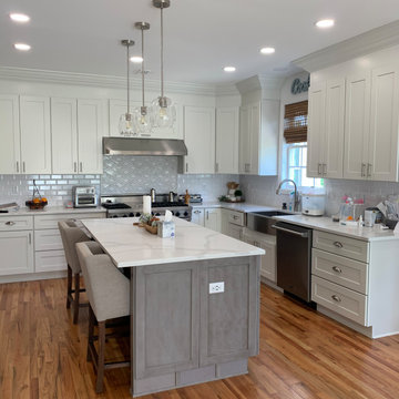 white shaker kitchen cabinets combine with grey shaker cabinets .