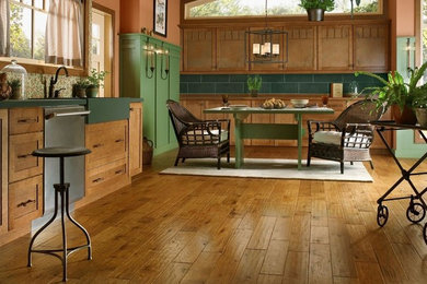Inspiration for a country kitchen in Miami with medium hardwood floors.