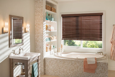 Inspiration for a large transitional master ceramic tile freestanding bathtub remodel in Other with open cabinets, white cabinets, beige walls and a wall-mount sink
