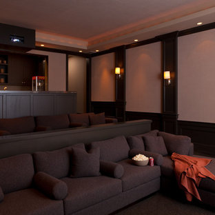 Home theater - huge contemporary open concept carpeted home theater idea in San Francisco with beige walls and a projector screen