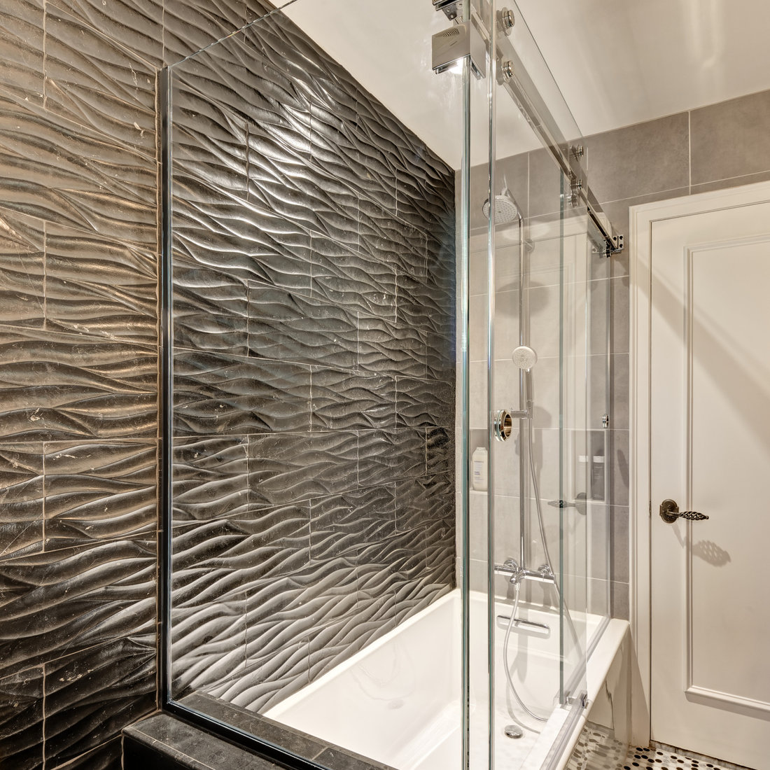 A Dramatic Bathroom in Grays & Chrome