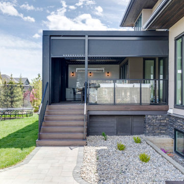 Adjustable StruXure Pergola Featuring Outdoor Kitchen With Screens & Heaters