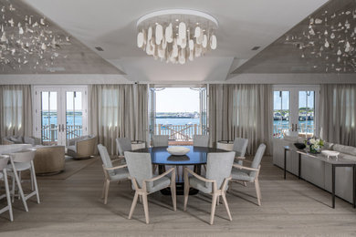 Mid-sized beach style medium tone wood floor and brown floor great room photo in New York