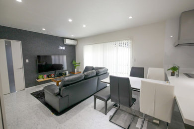 This is an example of a mid-sized modern open concept living room in Other with white walls, ceramic floors, a wall-mounted tv and white floor.