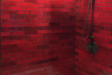 Example of a trendy red tile and ceramic tile bathroom design in Los Angeles with red walls