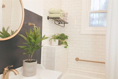 Design ideas for a mid-sized traditional bathroom in San Francisco with shaker cabinets, white cabinets, an alcove tub, an alcove shower, a two-piece toilet, white tile, subway tile, blue walls, cement tiles, an integrated sink, solid surface benchtops, grey floor, a shower curtain and white benchtops.
