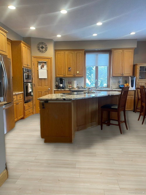 New flooring for kitchen with honey oak cabinets. Updated examples