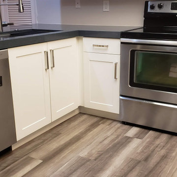 White Shaker with Waterfall edge Silestone countertop