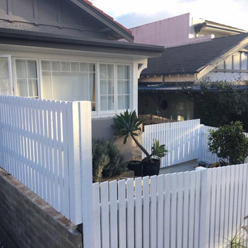 Picket fences not only complement a garden but the house as well.