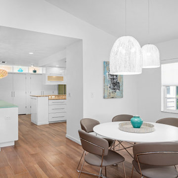 Coastal Dining Area with Modern Lighting — Bay Isles Longboat Key