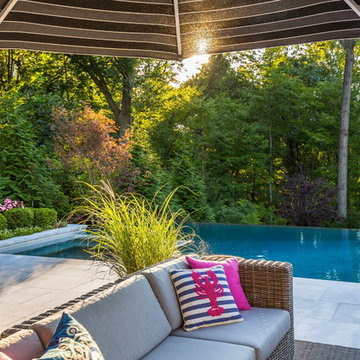 Luxury vanishing edge swimming pool and outdoor living area Ridgewood NJ
