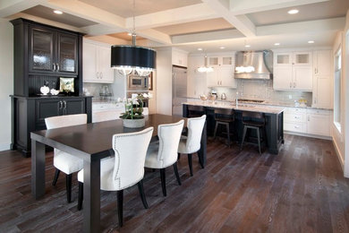 Design ideas for a traditional kitchen/dining combo in Calgary with dark hardwood floors and no fireplace.