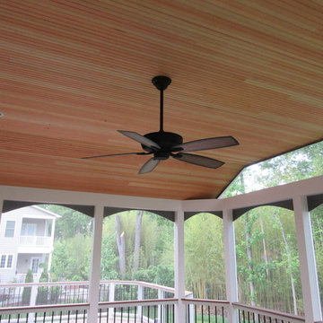 A beaded fir ceiling provides a finished look along with a ceiling fan and reces