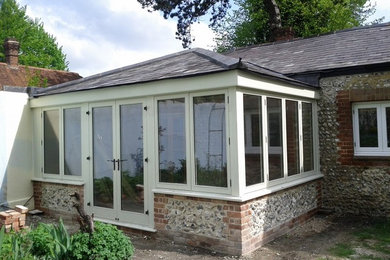 Design ideas for a traditional sunroom in Hampshire.