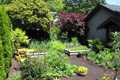 Inspiration for a traditional vegetable garden landscape in Vancouver.
