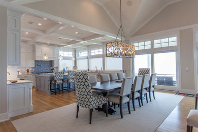 Inspiration for a large beach style open plan dining in Other with beige walls, light hardwood floors, no fireplace and brown floor.