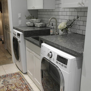 Inspiration for a small contemporary galley separated utility room in Toronto with a submerged sink, shaker cabinets, white cabinets, engineered stone countertops, green walls and a side by side washer and dryer.