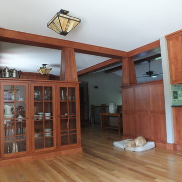 Craftsman built in bookcases, tapered pillars, and beams