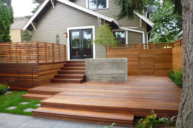 Large modern backyard deck in Toronto with no cover.