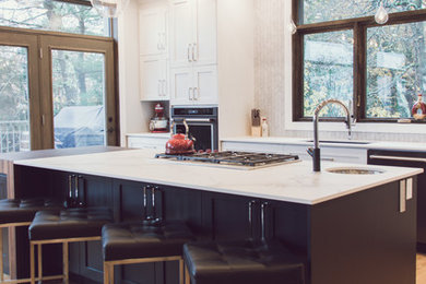 Open concept kitchen - mid-sized transitional single-wall light wood floor and beige floor open concept kitchen idea in Montreal with a double-bowl sink, shaker cabinets, white cabinets, marble countertops, gray backsplash, marble backsplash, paneled appliances, an island and gray countertops